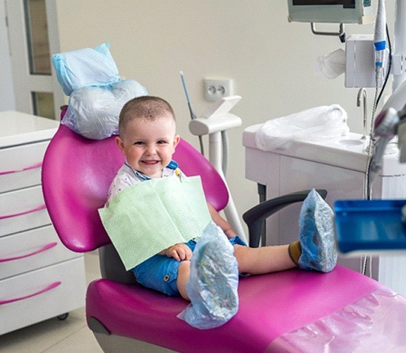 Woman helping her son brush teeth at Age One Visit in Sycamore, IL