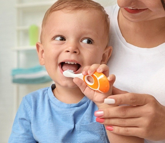 Boy giving a thumbs up after his Age One Visit