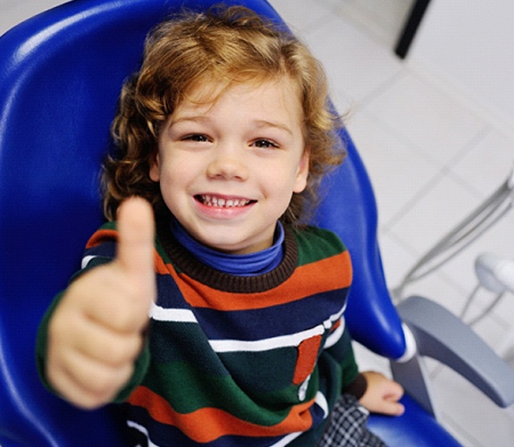 Boy giving a thumbs up after his Age One Visit