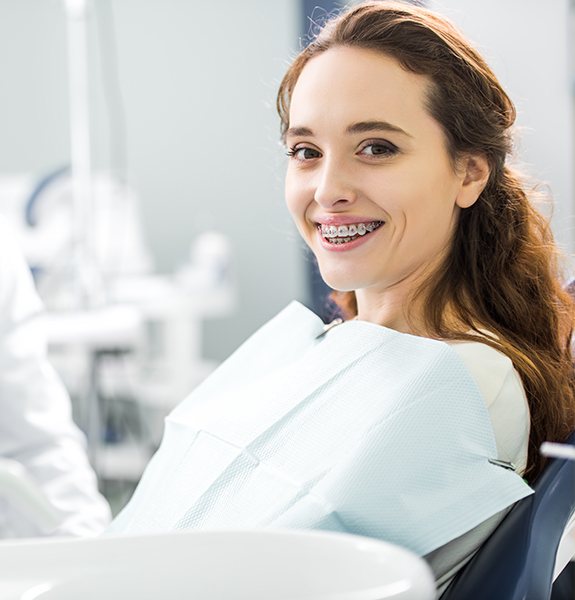 Woman with braces in orthodontic chair
