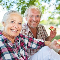 People eating with dental implants in Sycamore