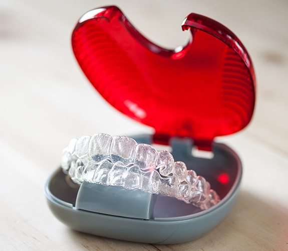 Set of Invisalign clear braces tray in carrying case