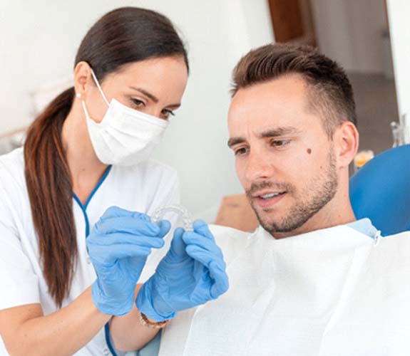 Patient and dentist discussing Invisalign in Sycamore