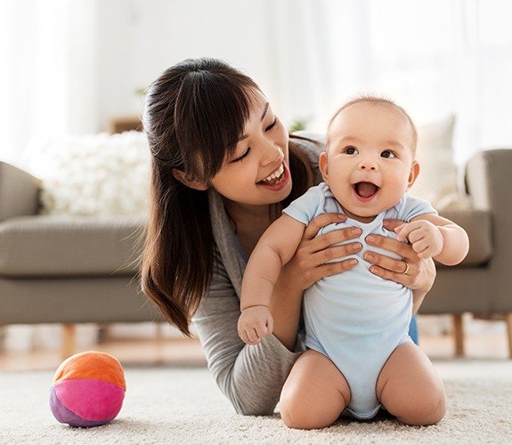Baby laughing after lip and tongue tie treatment
