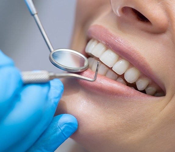 Patient receiving scaling and root planing gum disease treatment