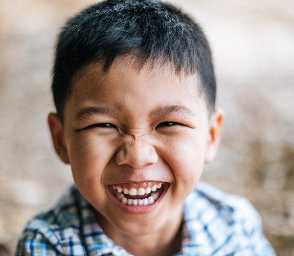 Boy smiling after Phase 1 orthodontics in Sycamore , IL