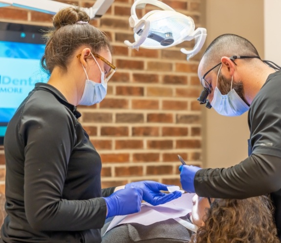 team members working on patient