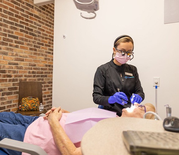 Woman smiling during preventive dentistry checkup