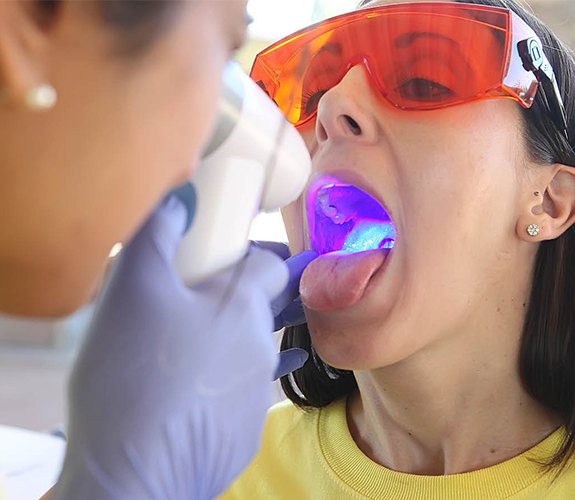 Patient receiving oral cancer screening