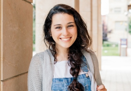 Young woman with healthy smile after orthodontic treatment