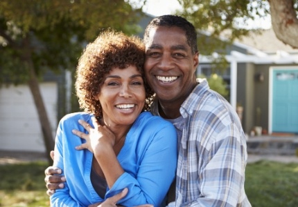 Man and woman smiling after relaxed sedation dentistry visit