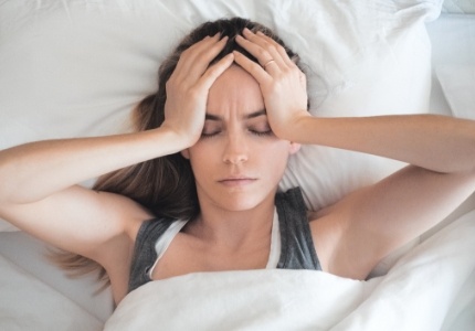 Tired woman in need of sleep apnea treatment