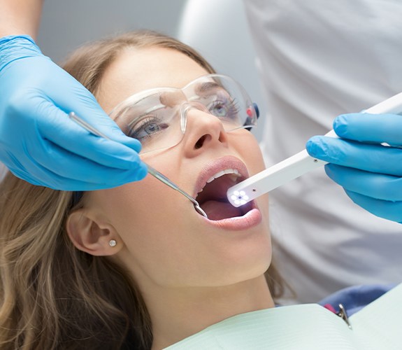 Dentist using intraoral camera to capture images