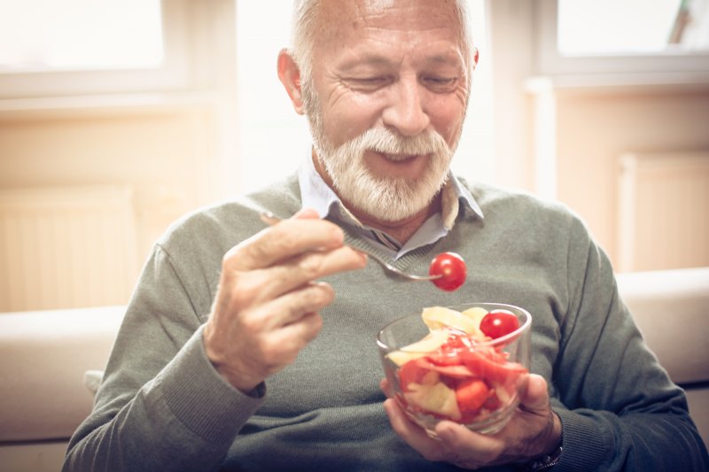 man eating a salad