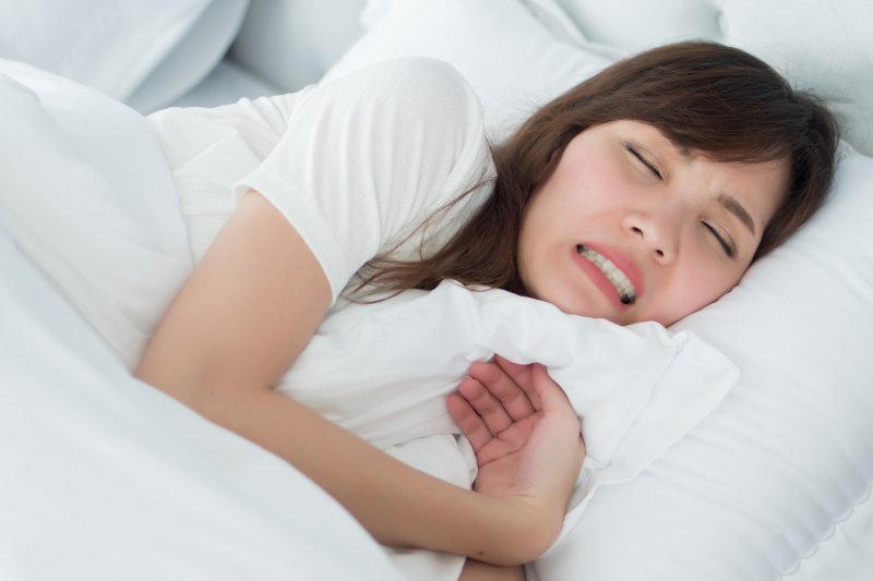 woman grinding her teeth while asleep